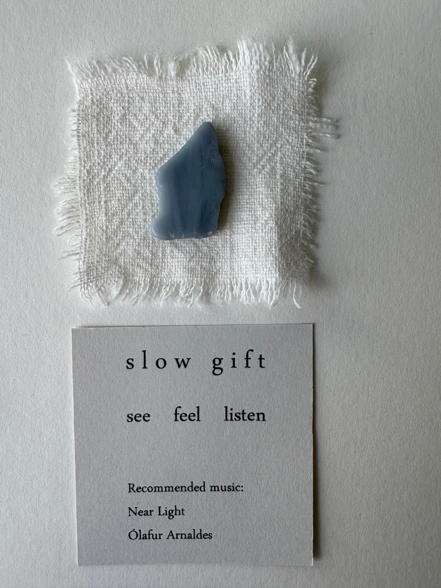 Slow gift with sea glass on woven linen